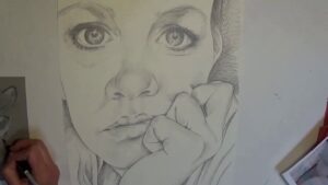Self Portrait with Gridlines, self portrait drawing of the artist with her face resting on her hand YouTube thumbnail by Heidi Rounds.